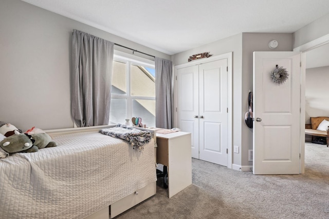 carpeted bedroom featuring a closet