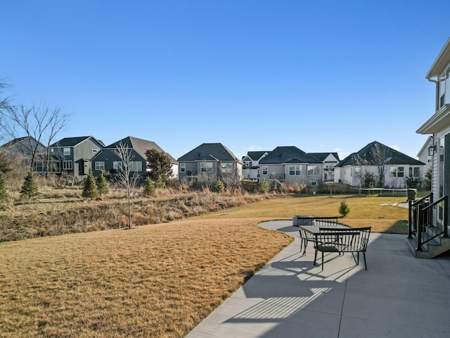 view of home's community featuring a patio area and a yard