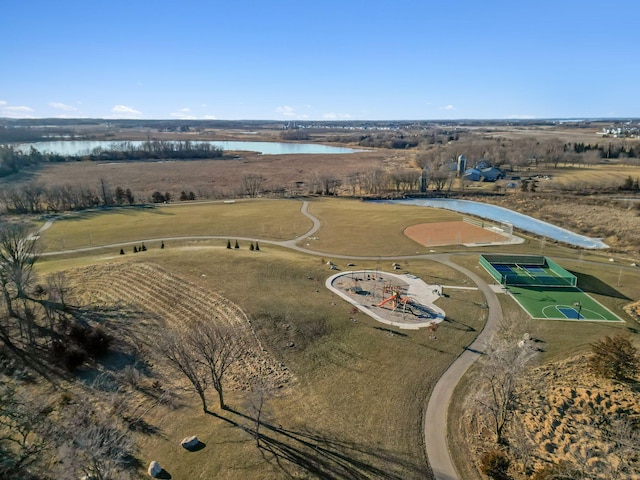 birds eye view of property with a rural view and a water view