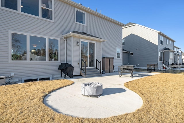 rear view of property featuring a patio area and a yard