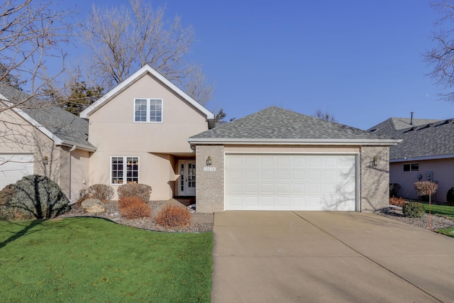 front facade with a garage and a front yard