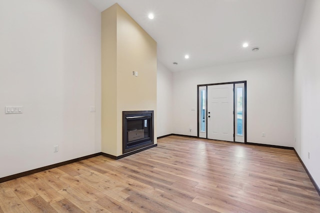 unfurnished living room with light hardwood / wood-style flooring