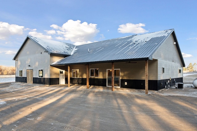 back of property featuring central air condition unit