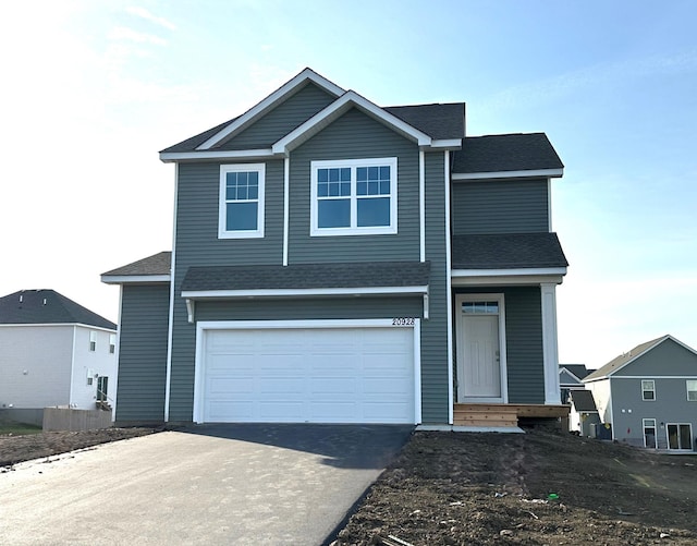 view of front of property with a garage