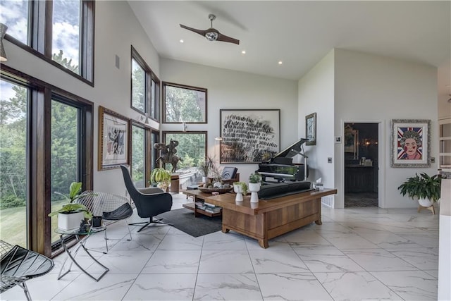 office space with ceiling fan and a high ceiling