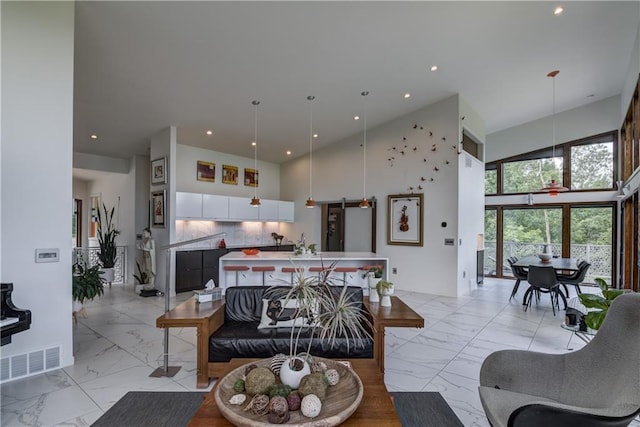 living room featuring a high ceiling