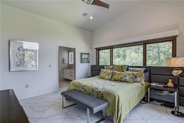 bedroom featuring ensuite bathroom, ceiling fan, and lofted ceiling