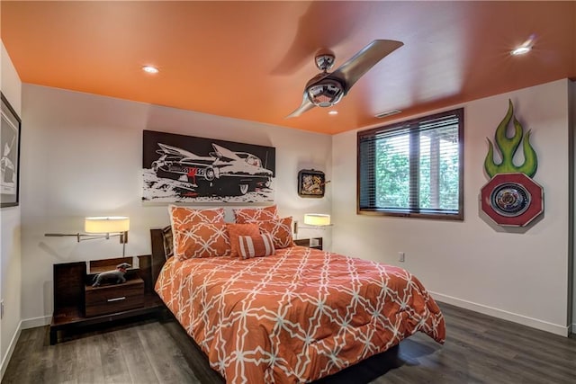 bedroom featuring ceiling fan and dark hardwood / wood-style floors