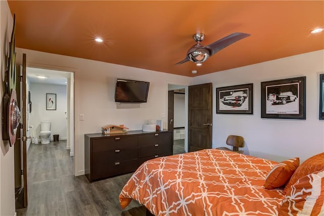 bedroom with ceiling fan, dark hardwood / wood-style flooring, and ensuite bath