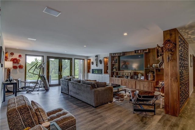 living room with french doors and dark hardwood / wood-style floors