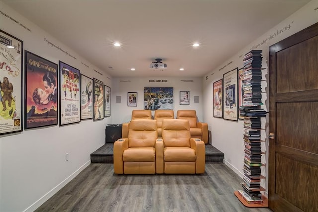 cinema room with hardwood / wood-style floors