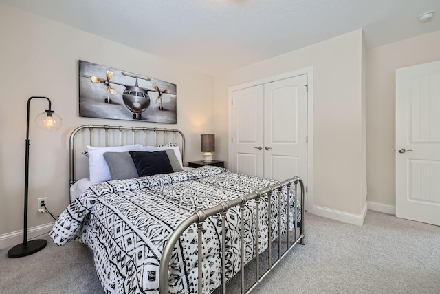 carpeted bedroom with a closet