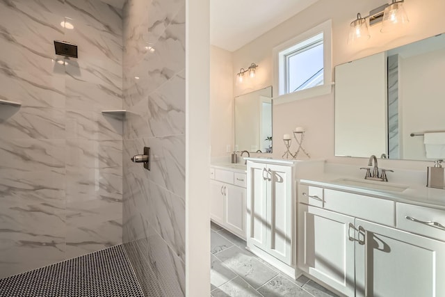 bathroom featuring vanity and a tile shower