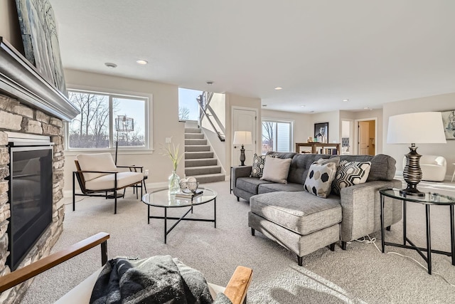 carpeted living room featuring a fireplace