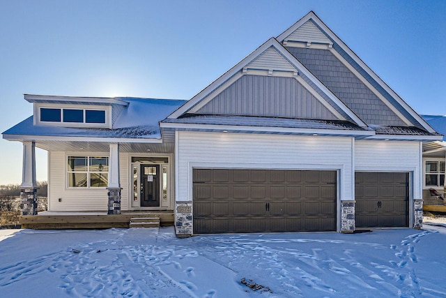 view of front facade with a garage and covered porch