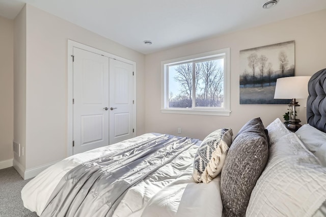 carpeted bedroom with a closet