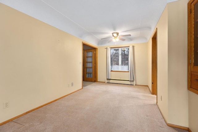 unfurnished room featuring baseboard heating, ceiling fan, and light colored carpet