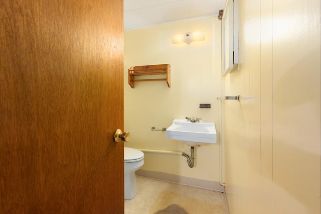 bathroom with toilet and sink