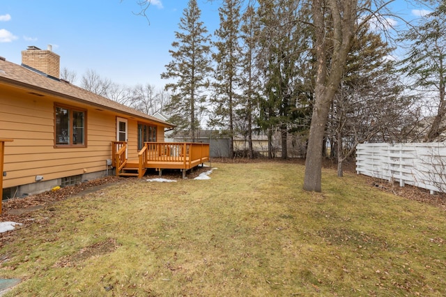 view of yard with a wooden deck