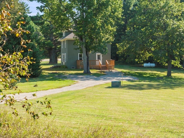 view of yard with a wooden deck