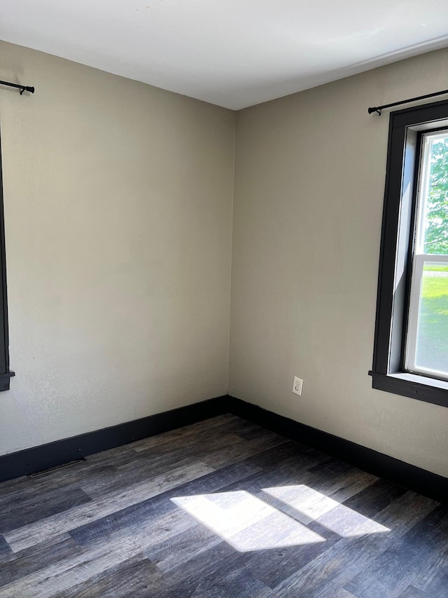 empty room featuring dark hardwood / wood-style floors