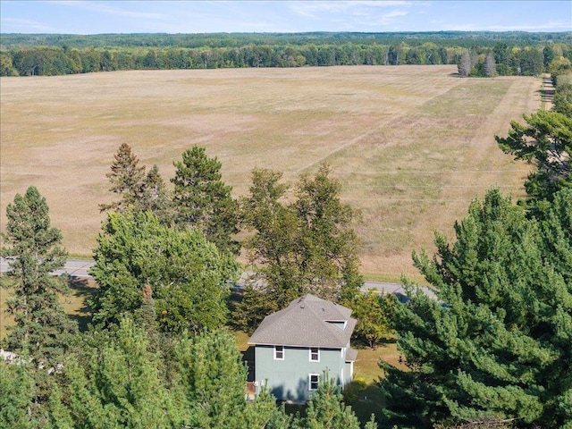 birds eye view of property with a rural view