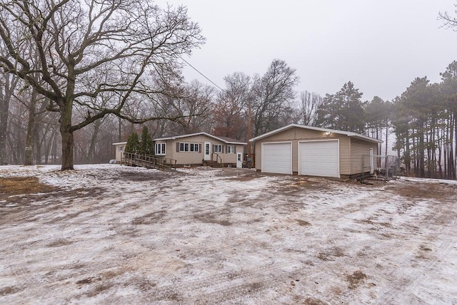 view of front of house with an outbuilding and a garage