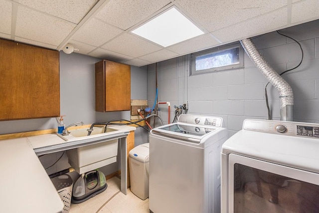 washroom with cabinets and independent washer and dryer