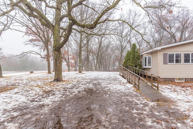 view of yard layered in snow