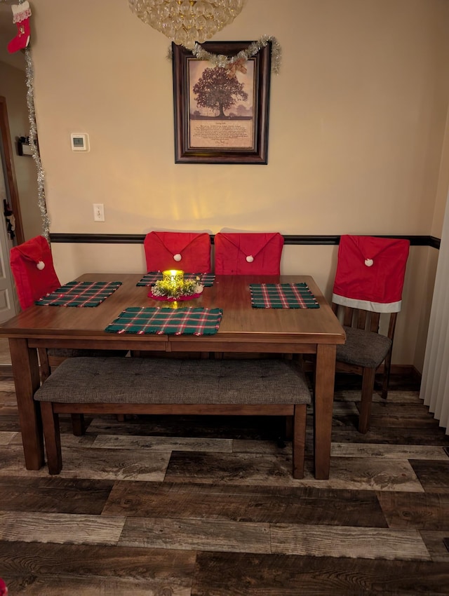 dining space with dark wood-type flooring