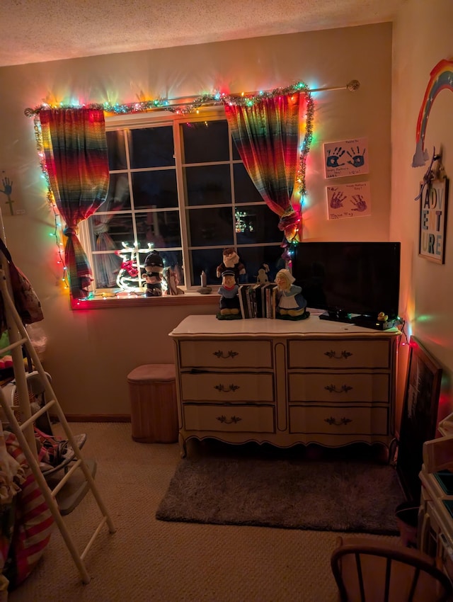 bedroom featuring carpet floors and a textured ceiling