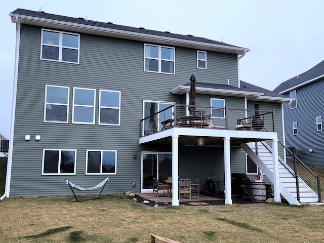 rear view of property featuring a yard and a patio area