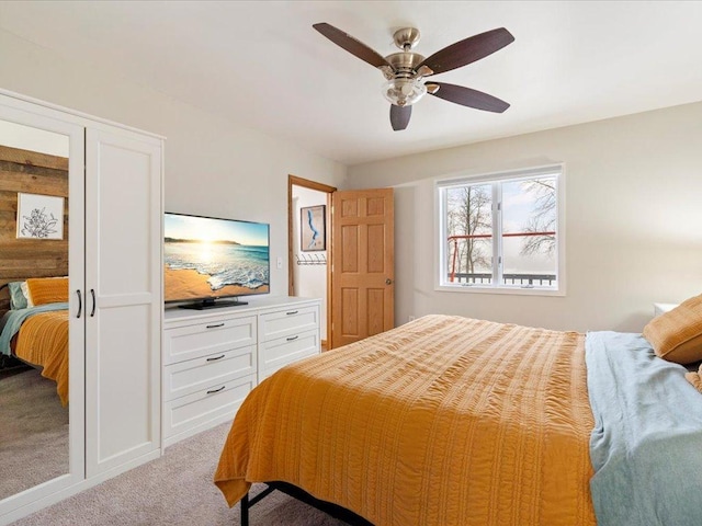 carpeted bedroom with ceiling fan