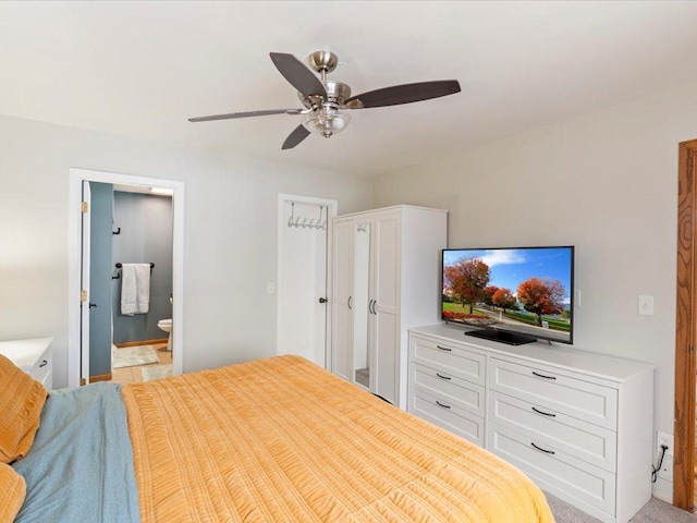 bedroom with ensuite bathroom and ceiling fan