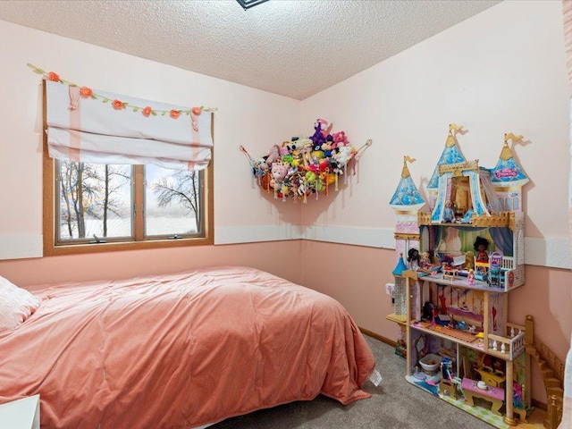 carpeted bedroom with a textured ceiling