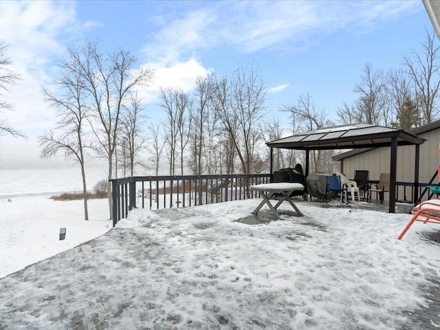 snow covered deck featuring a gazebo