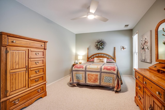 bedroom with light colored carpet and ceiling fan