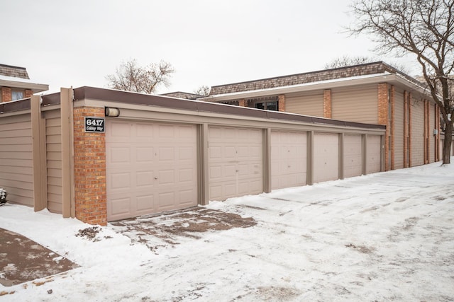 view of snow covered garage