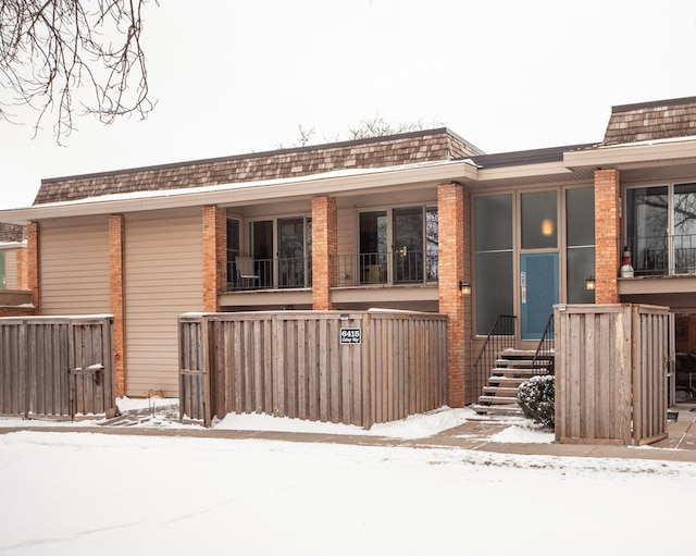 view of snow covered property