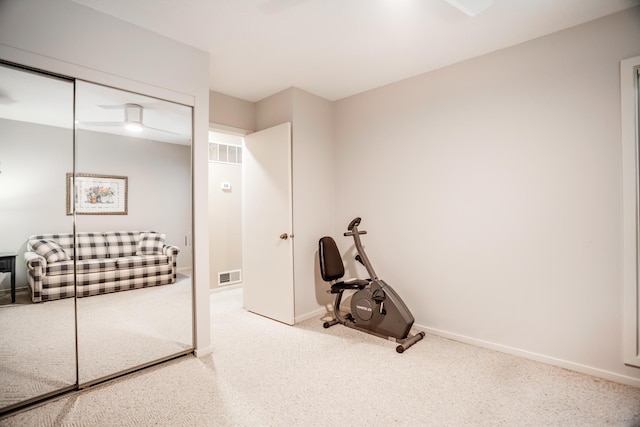 exercise room featuring carpet