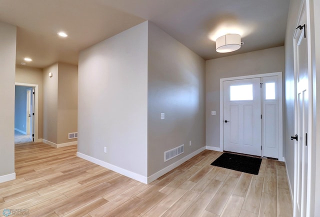 foyer entrance featuring light hardwood / wood-style flooring