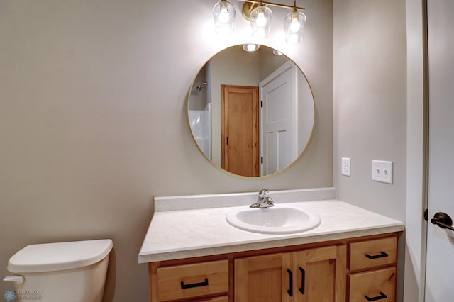 bathroom with vanity and toilet