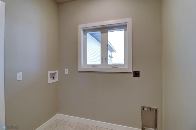 washroom with hookup for a washing machine and hookup for an electric dryer