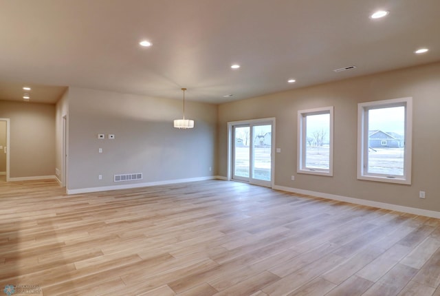 unfurnished room featuring light hardwood / wood-style floors