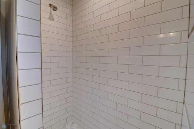 bathroom with a tile shower