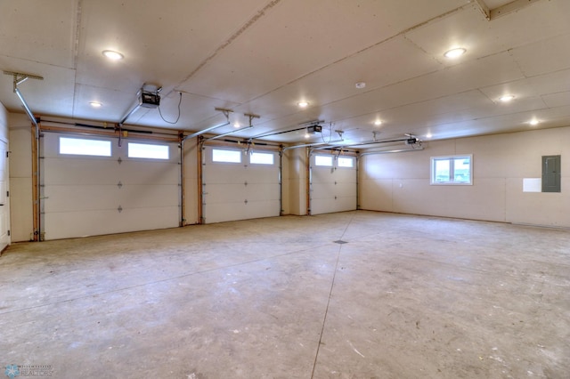 garage with electric panel and a garage door opener