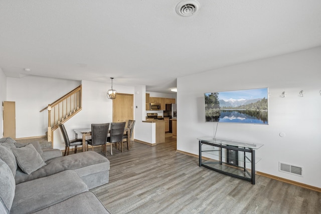 living room with light hardwood / wood-style flooring