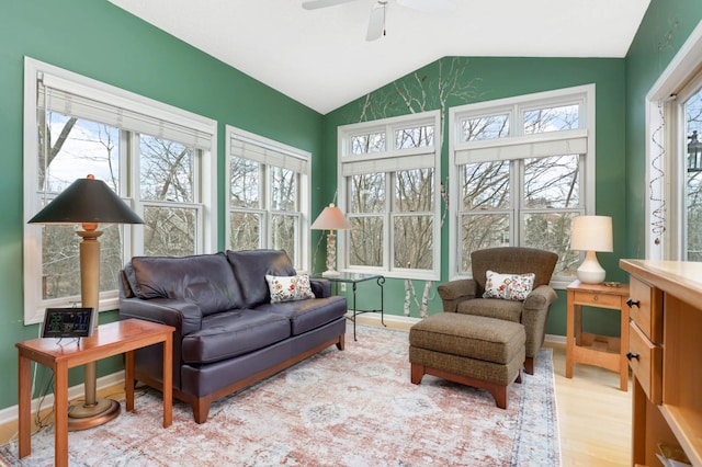 sunroom / solarium with lofted ceiling and ceiling fan