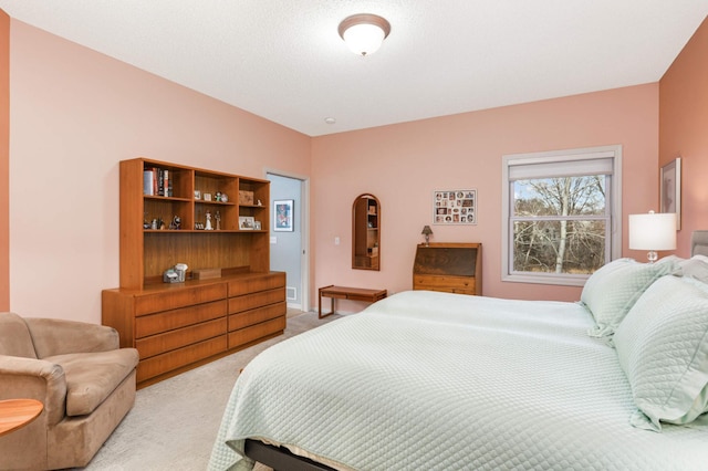 bedroom with light colored carpet