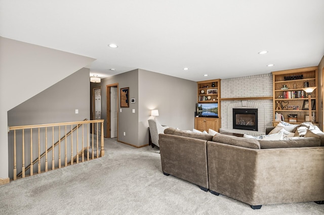 unfurnished living room with recessed lighting, baseboards, light carpet, and a brick fireplace